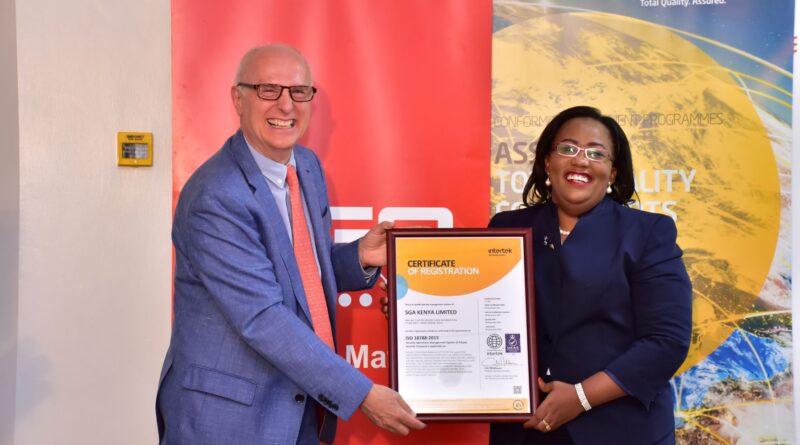 SGA Security CEO & Chairman Julius Delahaije receives ISO 18788 Certificate from Intertek Business Regional Manager Millicent Njuguna. PHOTO/COURTESY